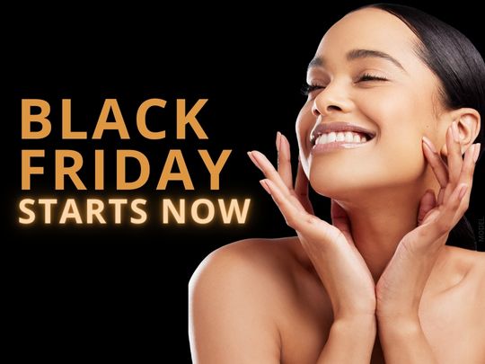 Woman with beautiful skin smiling (model) and text that reads "Black Friday Starts Now"